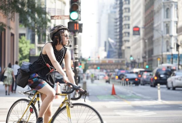 Cyclist in downtown Chicago, which has recently installed a new series of protected bike lanes Russell Ingram, courtesy of Chicago Loop Alliance