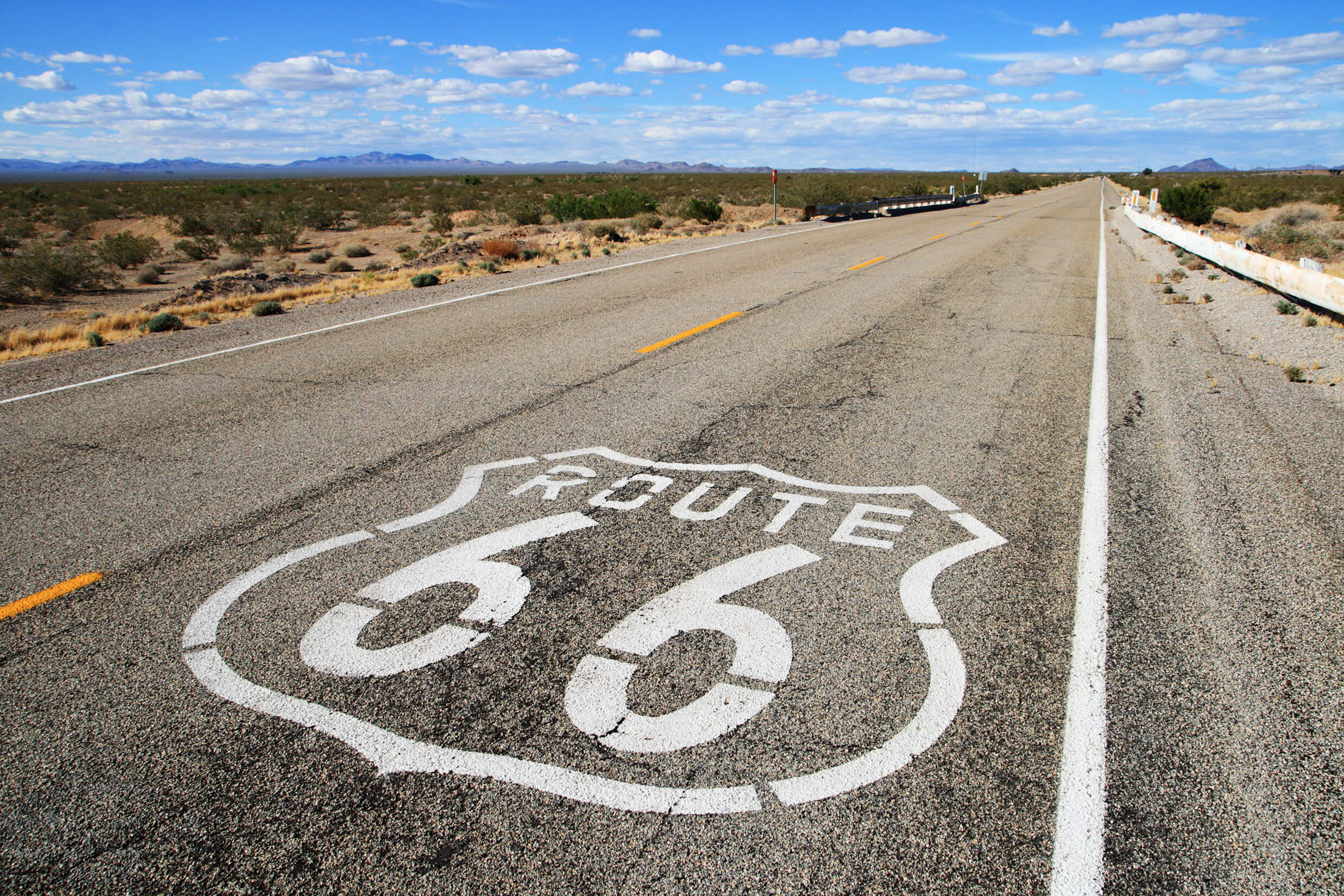 Photo of Route 66 road with sign painted on it